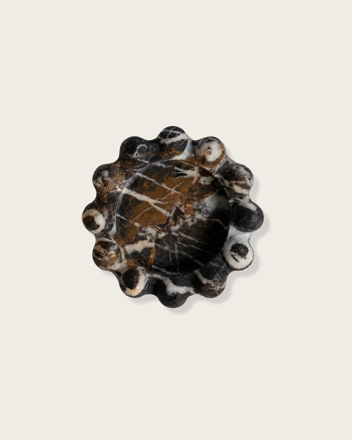 A scalloped marble catchall