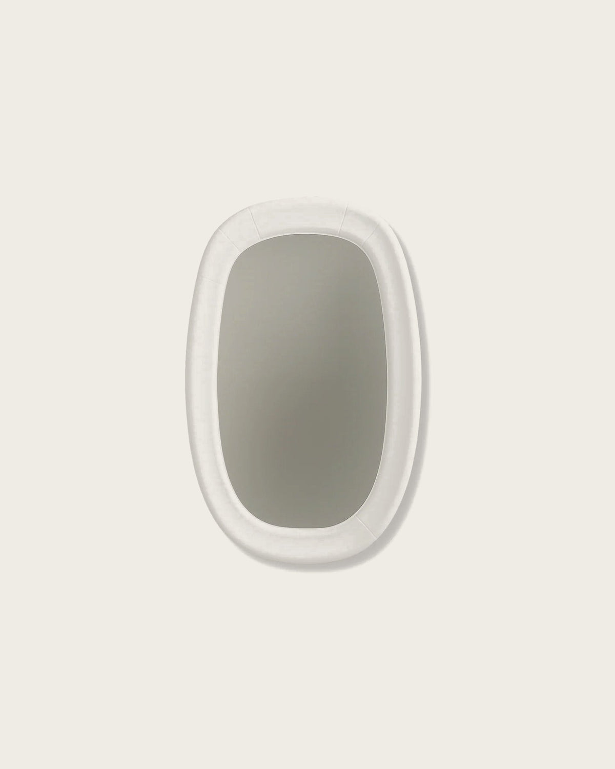 A plaster-framed mirror