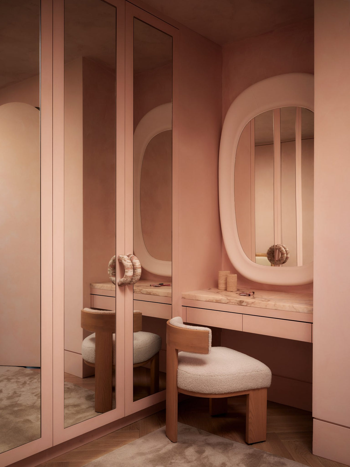 Pink plaster dressing room with a Hannah Plaster Mirror and Lane Donut Handles